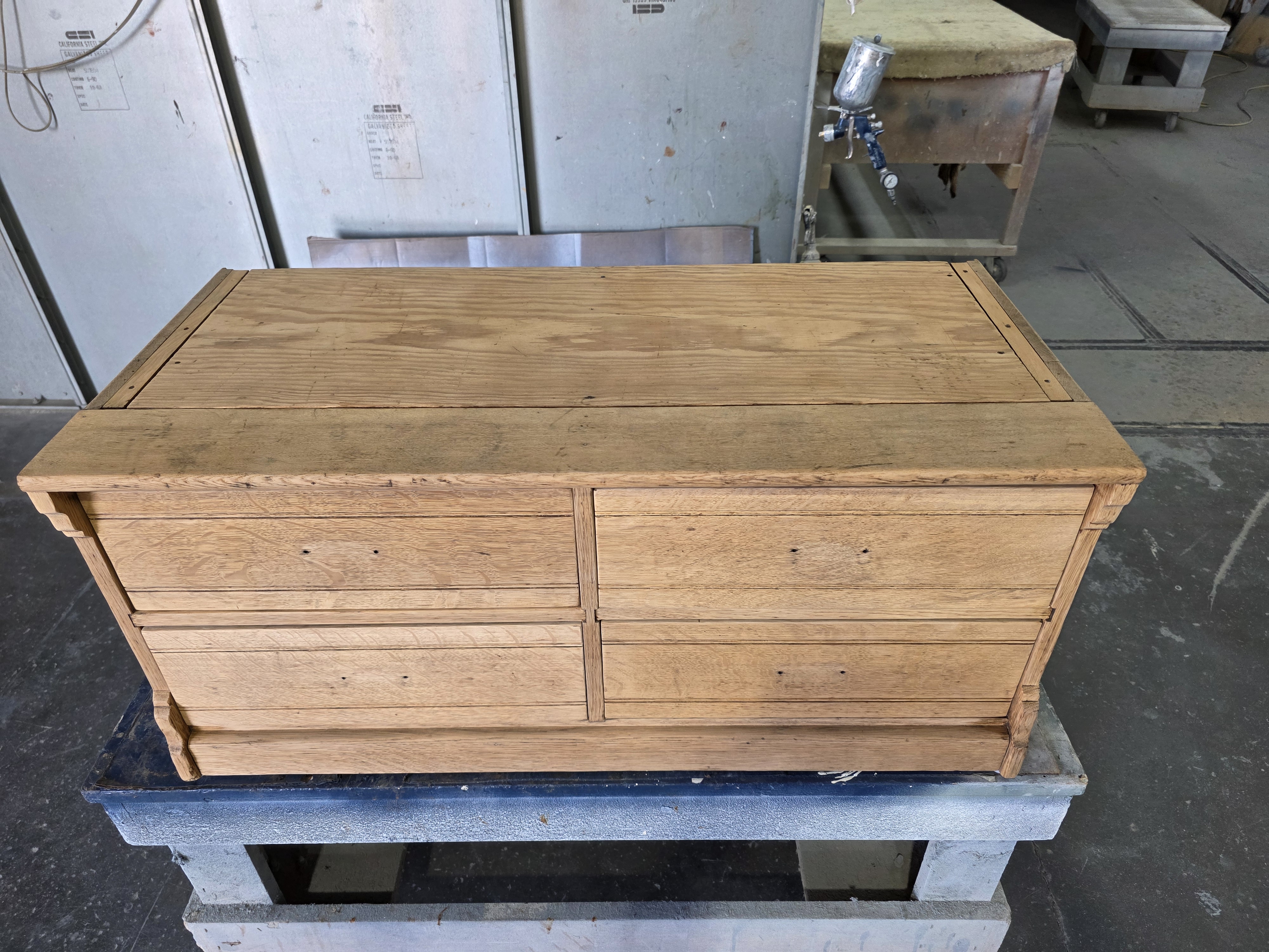 Stripped oak dresser ready for new finish in professional shop